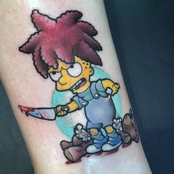 Dark-humored tattoo of a young Sideshow Bob with a bloody knife, standing over teddy bears, in a cartoonish yet eerie design.
