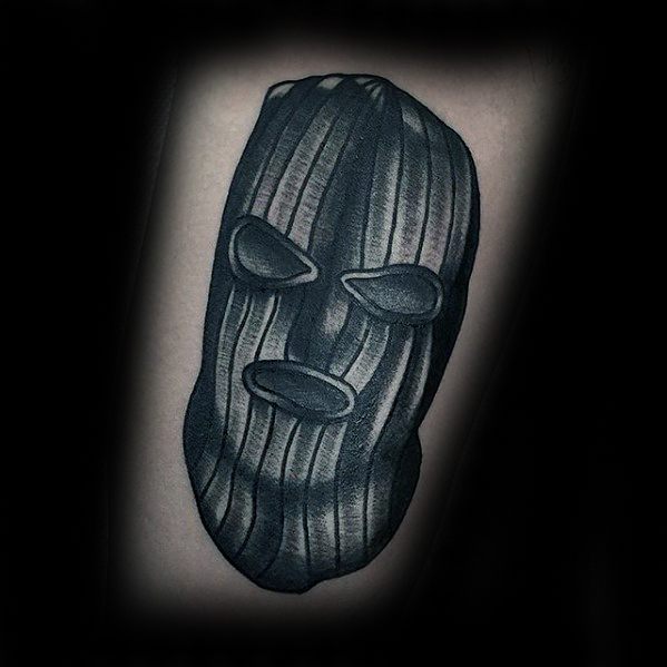 Tattoo of a dark, stylized ski mask with heavy shading and deep folds, giving it a bold and intense look.