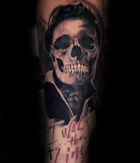 Tattoo of Johnny Cash with a skull face, text reads "I walk the line"