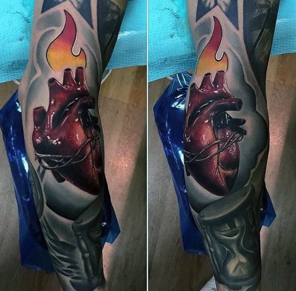 Realistic 3D tattoo sleeve featuring an anatomical heart wrapped in barbed wire with a burning flame, complemented by a detailed hourglass.