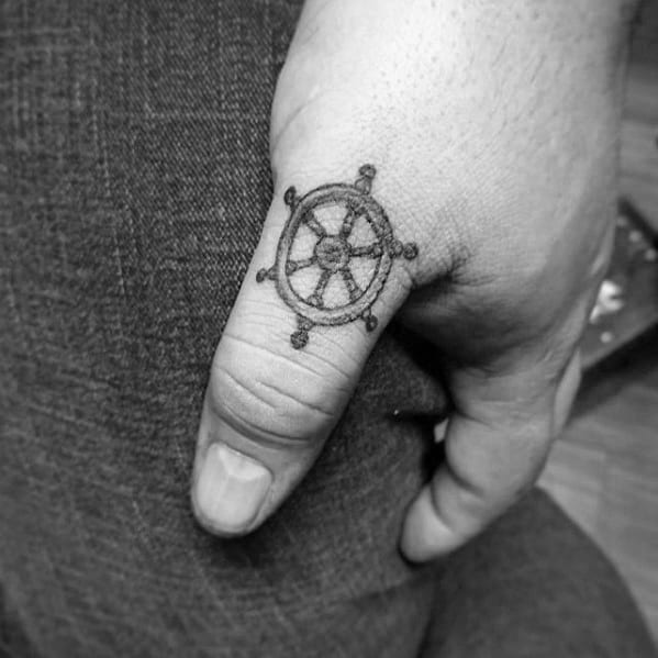 Guys Small Manly Ship Wheel Thumb Tattoo Designs