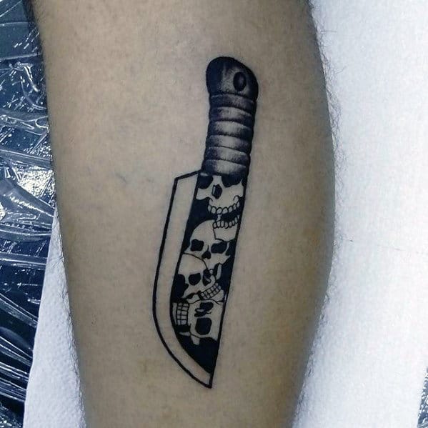 Guys Small Skull Dagger Blade Leg Tattoo Design