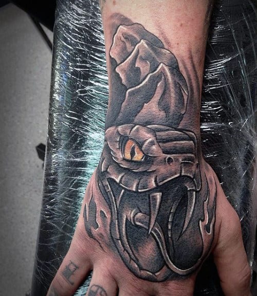 Guy's Snake Tribal Tattoo On Hand