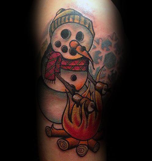 Playful snowman tattoo wearing a beanie and scarf, roasting marshmallows over a campfire, blending winter charm with a cozy outdoor vibe.