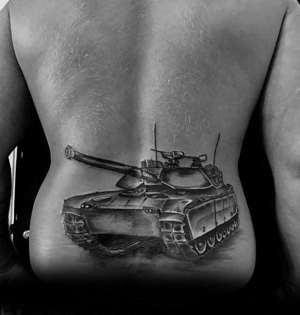 Realistic tank tattoo on the lower back, with fine shading and a perspective that shows the vehicle advancing forward.