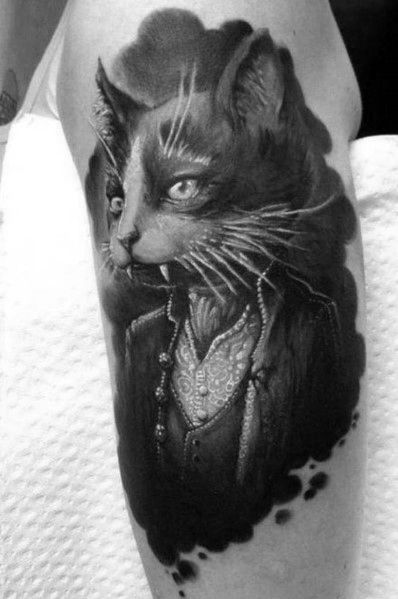 Realistic black and gray tattoo of a regal cat dressed in vintage attire, featuring fine details for an elegant and sophisticated design.