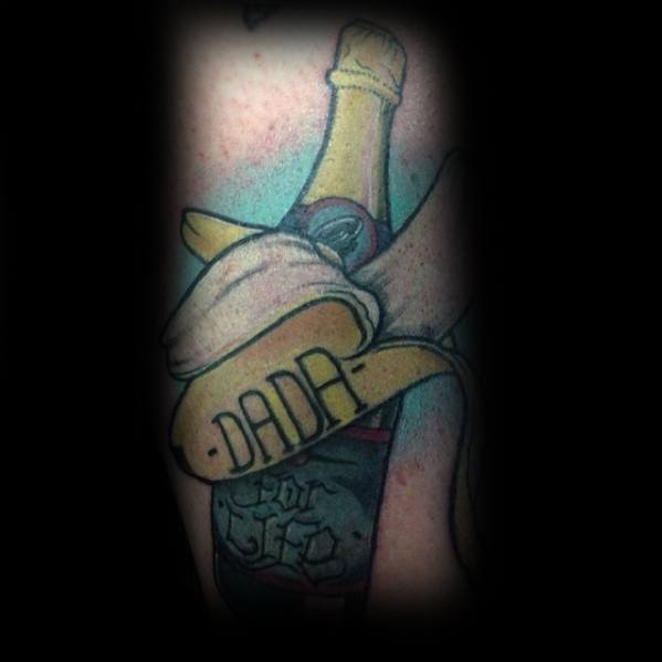 Colorful tattoo of a champagne bottle wrapped in a peeled banana with the word “DADA” on the peel and “For Life” on the label.