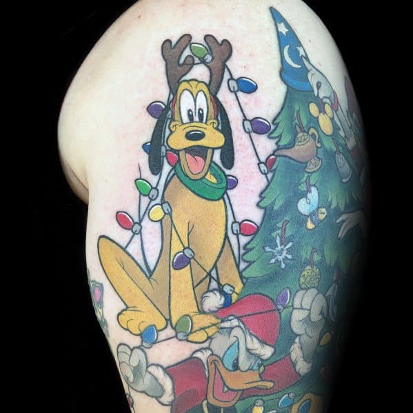 Christmas tattoo featuring Pluto wearing reindeer antlers, tangled in colorful holiday lights, alongside Disney characters in a festive, animated holiday scene.