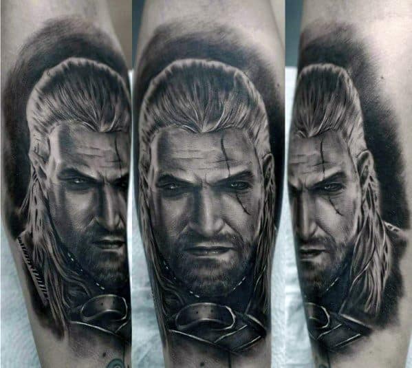 Geralt tattoo in black and gray realism, featuring a fierce expression, battle scars, and flowing silver hair with detailed shading and depth.