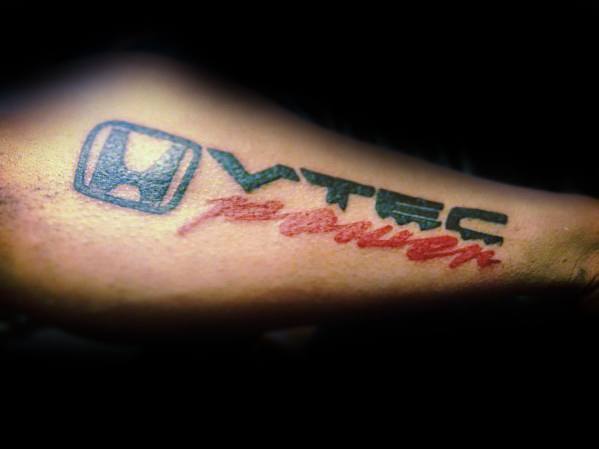 Honda VTEC Power tattoo on a man's forearm, featuring the Honda logo in black with bold lettering and red script for a dynamic look.