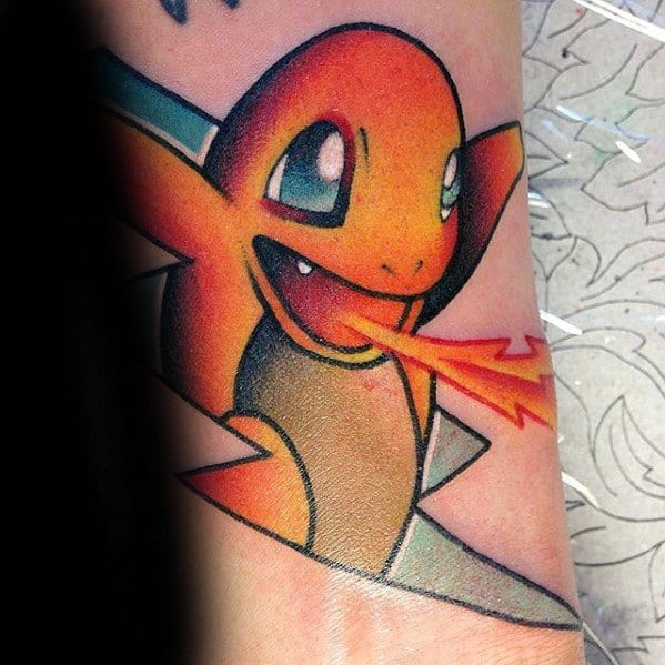 Bold Charmander tattoo bursting through a geometric shape, breathing fire with a wide grin and vibrant orange and red tones.