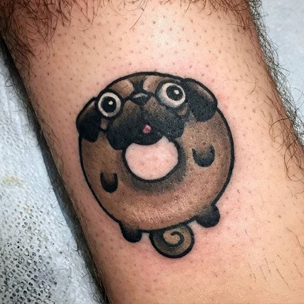 Tattoo of a cute cartoon pug shaped like a donut, with big eyes, a curled tail, and a playful expression on its face.