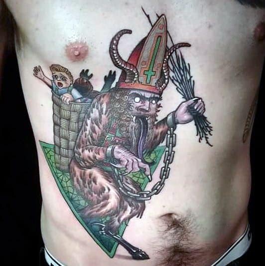 Colorful Krampus tattoo on torso showing the creature in bishop attire, holding birch branches, with a child in a basket on his back.