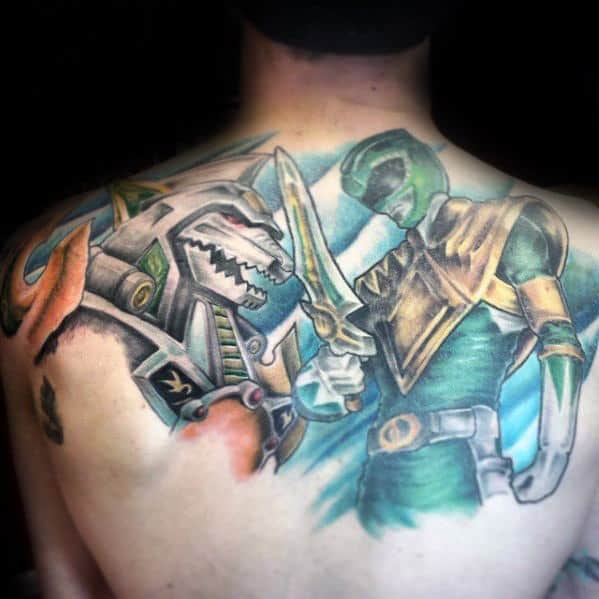 Vibrant back tattoo of the Green Ranger and Dragonzord in battle stance, featuring soft shading, glowing highlights, and fluid motion.
