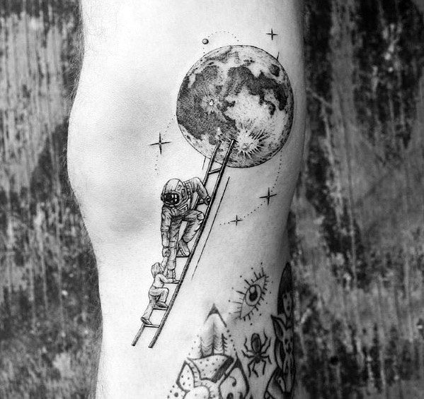 Creative tattoo of an astronaut climbing a ladder toward the moon, symbolizing ambition and exploration, ideal for men's arms or legs.