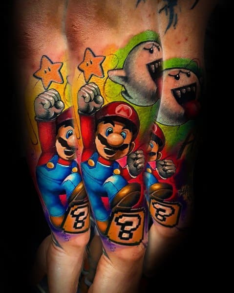 Vibrant *Super Mario* tattoo with bold colors, featuring Mario jumping with a question block, stars, and Boo ghosts for a dynamic gaming design.