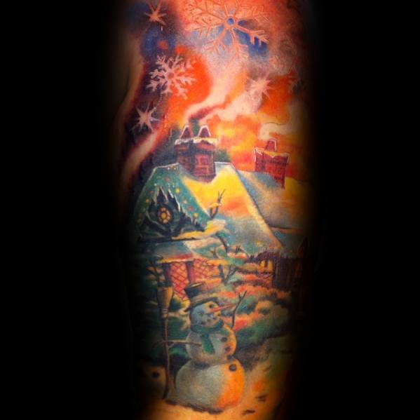Vibrant snowman tattoo set in a cozy winter village with glowing houses, swirling snowflakes, and a warm sunset sky, creating a magical scene.