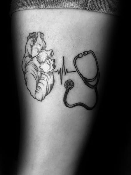Heart and stethoscope tattoo with an ECG line, symbolizing the connection between medicine, life, and a passion for healthcare.