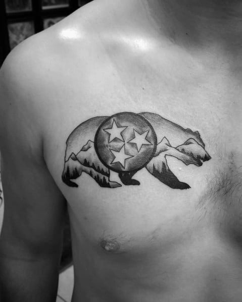 Black and grey Tennessee three-star emblem tattoo inside a bear silhouette, featuring mountain details for a rugged and nature-inspired design.