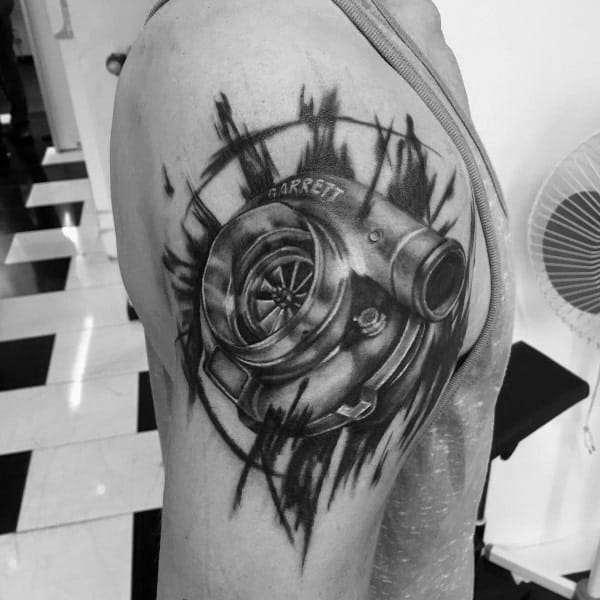 Realistic turbocharger tattoo on the upper arm with a ripped skin effect, featuring fine shading and bold details, symbolizing speed and mechanical power.