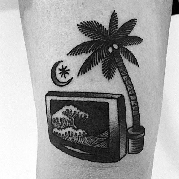 Black ink tattoo of a vintage TV displaying ocean waves, with a palm tree growing from the screen, alongside a crescent moon and star.