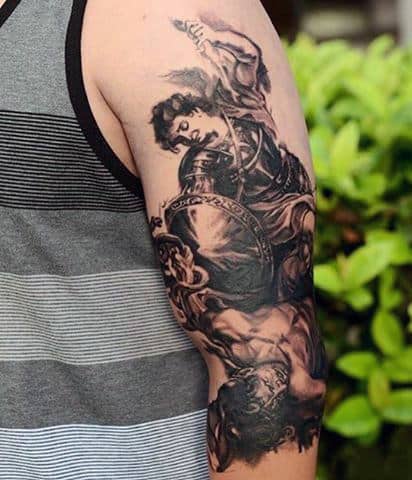 Guy's Tattoos Of St Micheal The Archangel In Black Ink