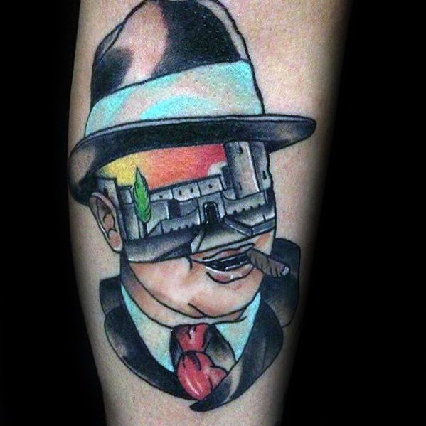 Al Capone tattoo featuring a creative design with a colorful scene of a castle reflected in the gangster's sunglasses, alongside his classic fedora and cigar.