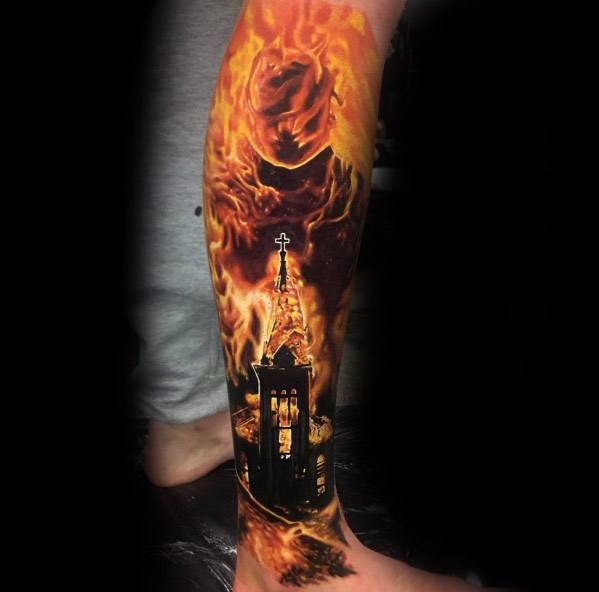 Realistic burning church tattoo on the calf with intense orange flames and glowing windows. Fiery smoke forms a ghostly face above the steeple.