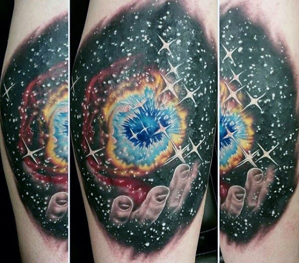 Nebula tattoo of a cosmic scene with a colorful nebula and a hand reaching out among stars