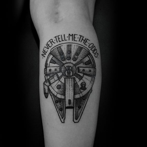 Minimalist black ink Millennium Falcon tattoo with dotwork shading and the phrase “Never tell me the odds” curved above the ship.