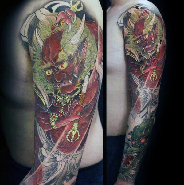 Detailed Raijin full sleeve tattoo with fierce red thunder god, golden accessories, and flowing elements in rich traditional style.