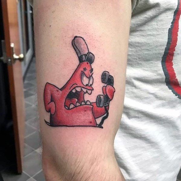 Tattoo of angry Patrick Star in red, wearing a Krusty Krab hat and yelling into a phone with fierce expression.