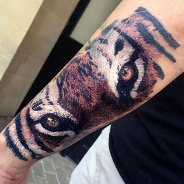 Guys Tiger Eyes Tattoo Designs On Outer Forearm