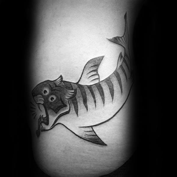 Black and grey tiger shark tattoo with a cartoon-style tiger head, blending humor and bold design in a playful hybrid concept.