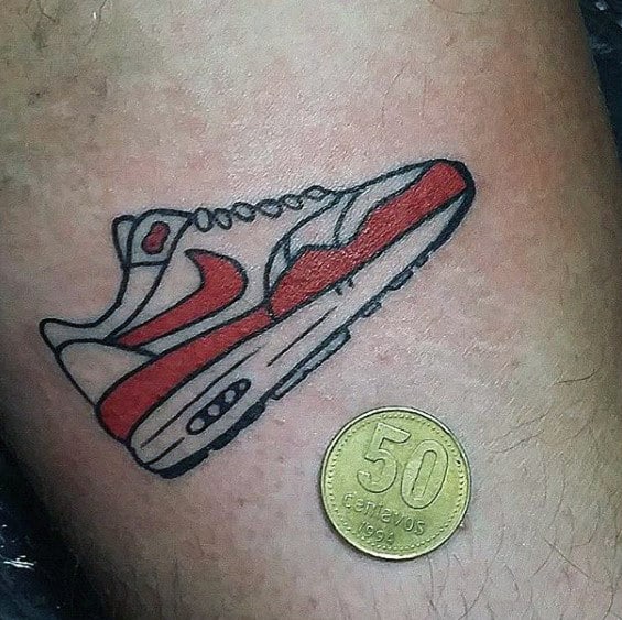 Guys Tiny Simple Nike Sneaker Tattoo On Arm