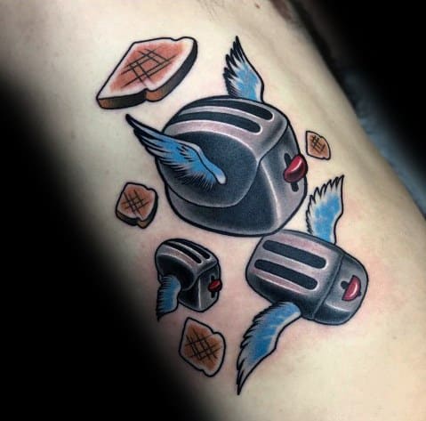 Surreal flying toaster tattoo with wings and scattered toast slices, blending bold colors and shading for a whimsical, nostalgic design.