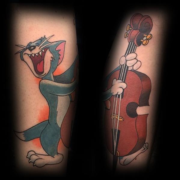 Vibrant forearm tattoo of Tom joyfully playing a cello, split across both arms to form a complete musical cartoon scene.