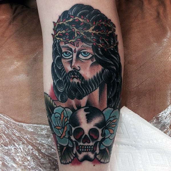Guys Traditional Jesus Leg Tattoo With Skull Design