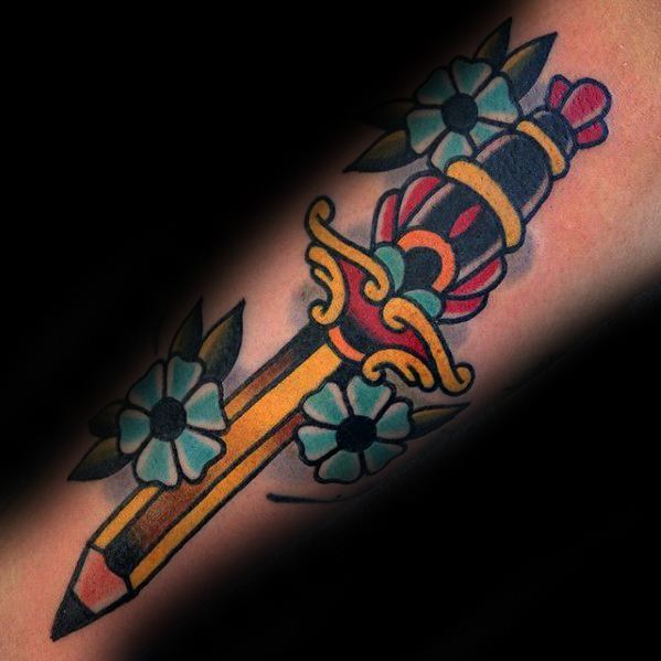 A vibrant tattoo of a dagger intertwined with flowers stands out against a dark background, resembling the bold strokes of an artist's pencil