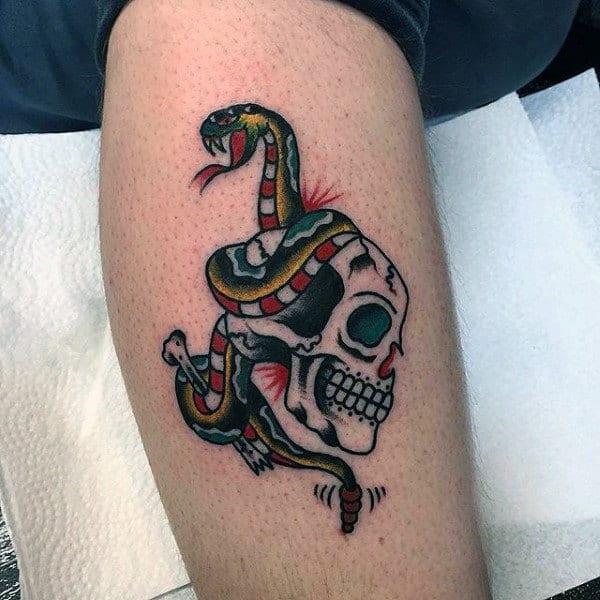 Guys Traditional Skull With Snake Tattoo Design On Leg