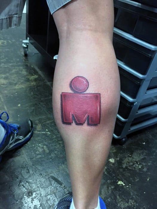 Bold red Ironman logo tattoo on the calf with a shaded, three-dimensional effect and clean black outline for added depth.