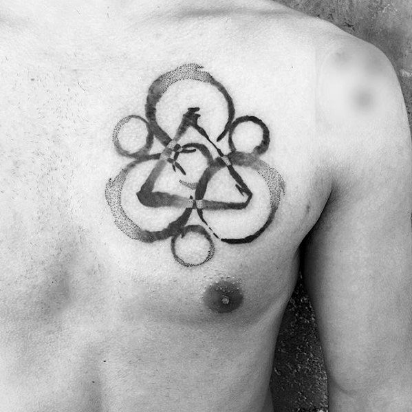 Chest Keywork tattoo in a bold brushstroke style, showcasing Coheed and Cambria’s emblem with a raw and expressive black ink look.