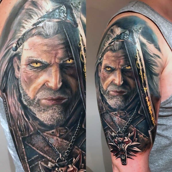 Hyper-realistic Witcher tattoo on the upper arm showing Geralt with glowing yellow eyes, detailed armor, and his iconic wolf medallion.