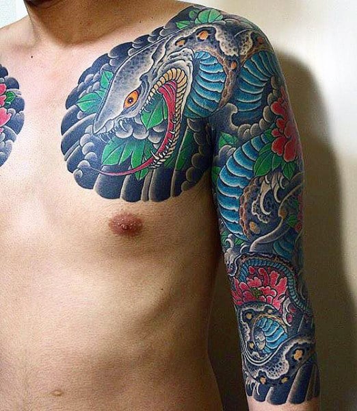 Man with detailed snake and flowers tattoo across chest and upper arm