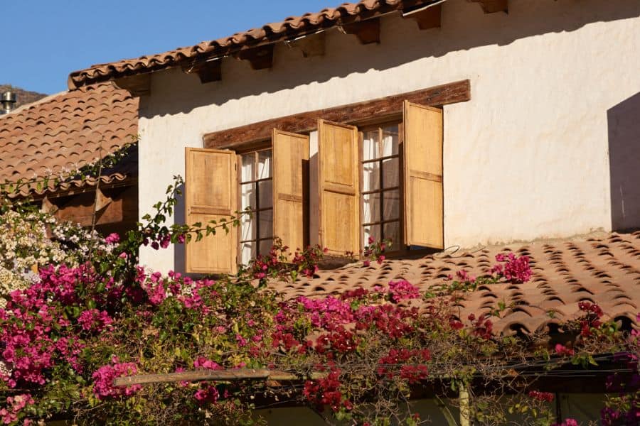 windows with shutters hacienda style spanish home