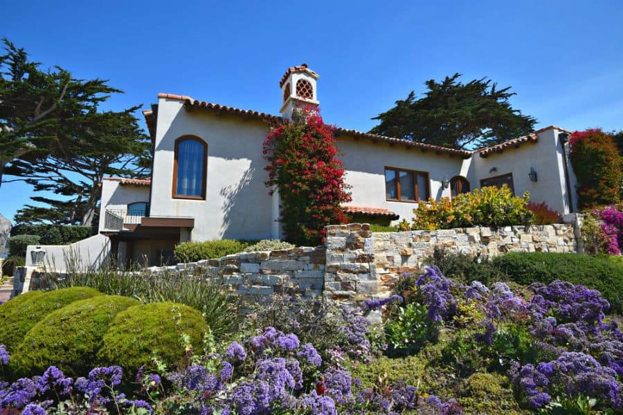 hacienda spanish-style home with retaining wall