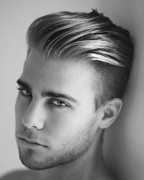 Voluminous, slicked-back undercut with a natural flow.