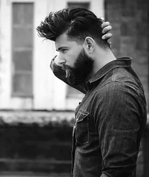 Man with a voluminous, styled undercut and full beard