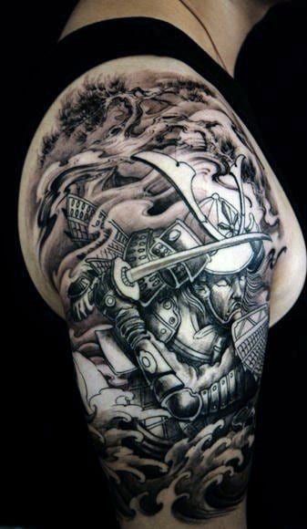 Black-and-white samurai tattoo on upper arm with waves and stormy background