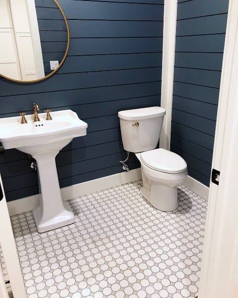mosaic floor tiles and blue shiplap wall bathroom